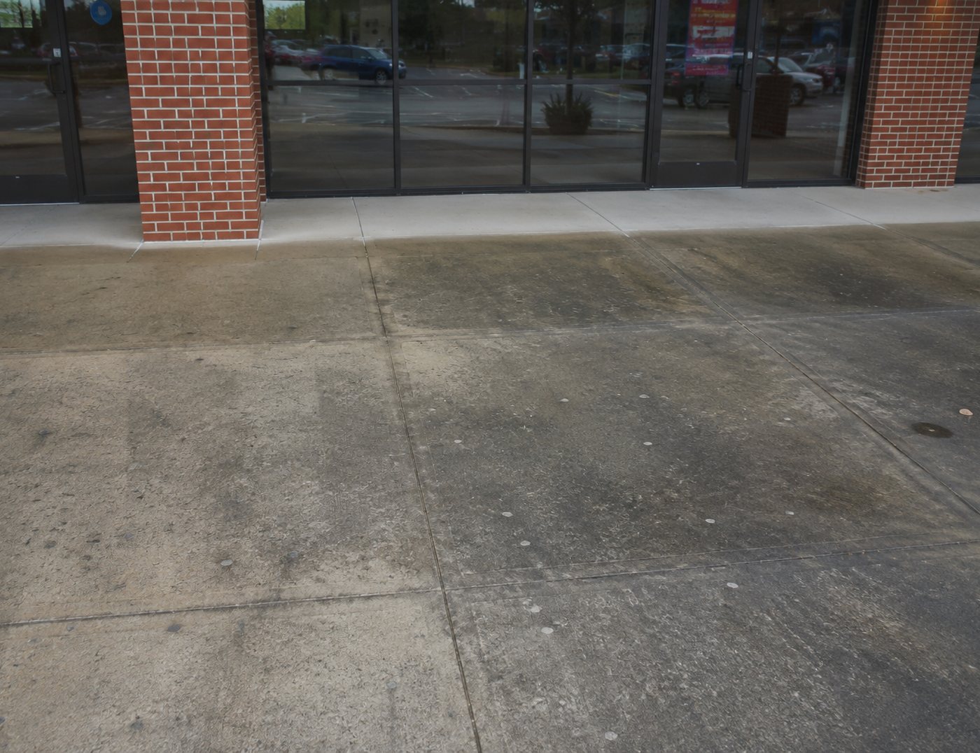 Dirty commercial concrete before pressure washing in Atlanta GA